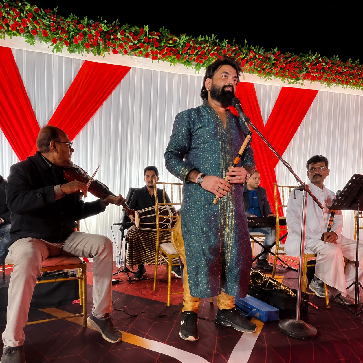 singer at sangeet event stage decor by DFD Wedding & Events
